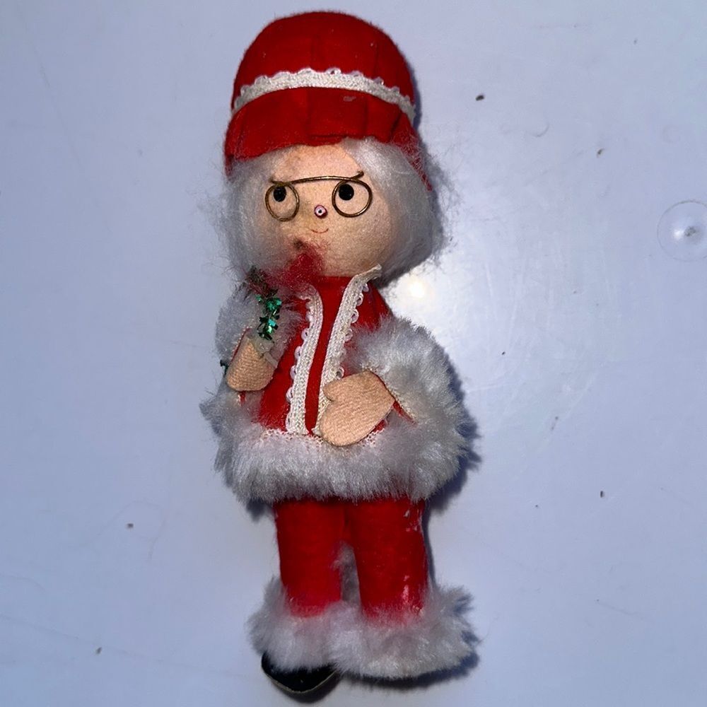 Vintage mid century Mrs Santa Claus holding wreath in red pantsuit & cap‎